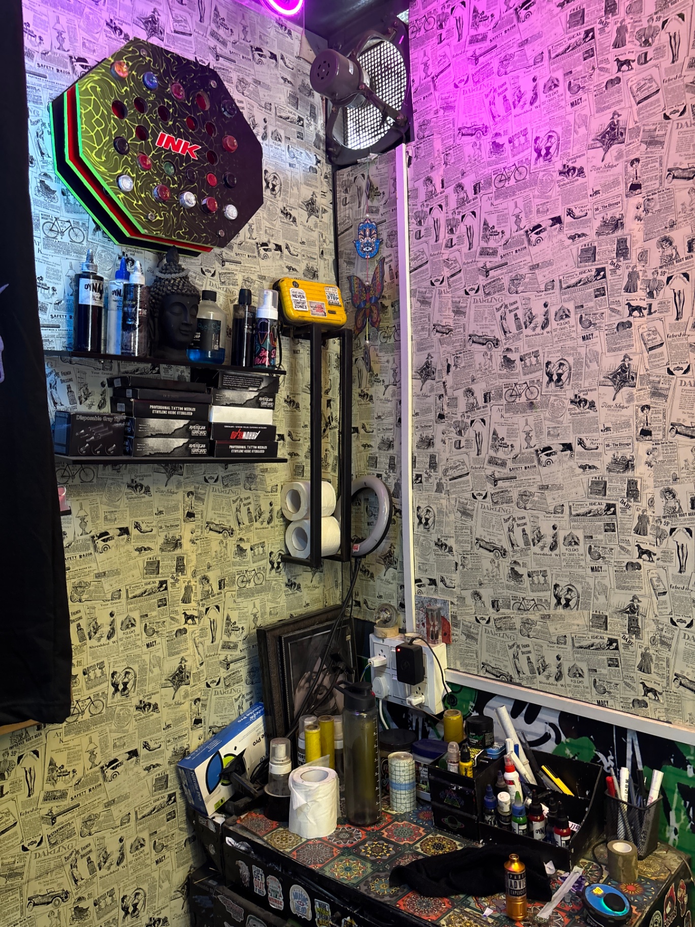 Sky Hangers tattoo studio — INK sign and interior